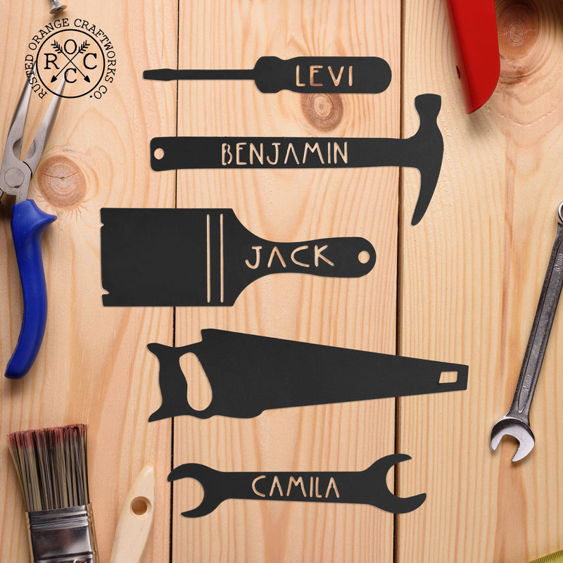 5 tools with name on table powder coated in black