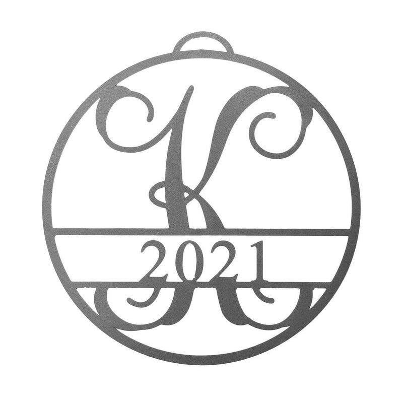 Circle metal ornament with monogram and year 2021, shown against white background.