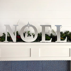 noel nativity set on mantle