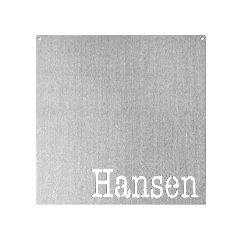 Square metal magnet board with the name Hansen etched at the bottom.