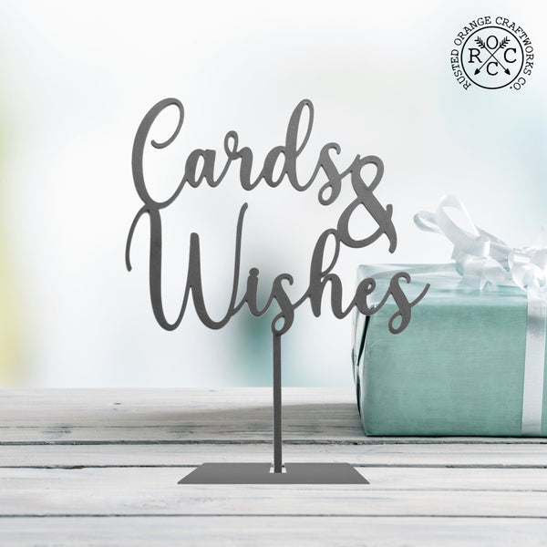 cards & wishes sign on table by gifts