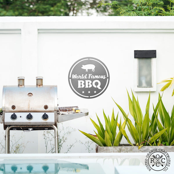 backyard bbq sign on wall by grill