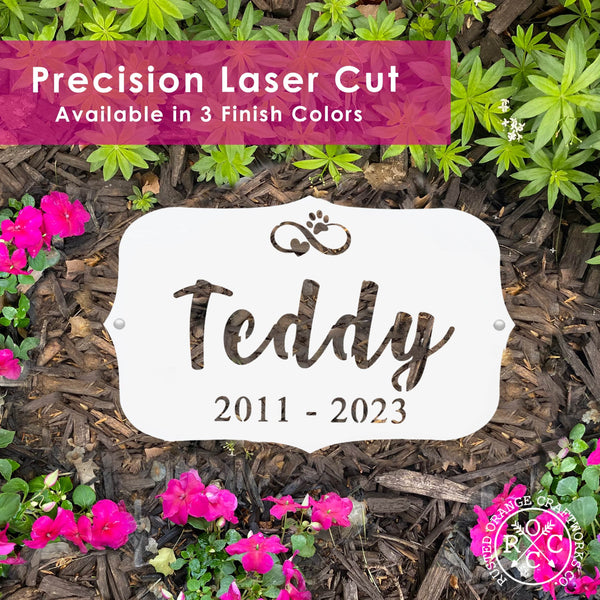pet memorial plaque laying flat in garden with banner that says precision laser cut available in 3 finish colors