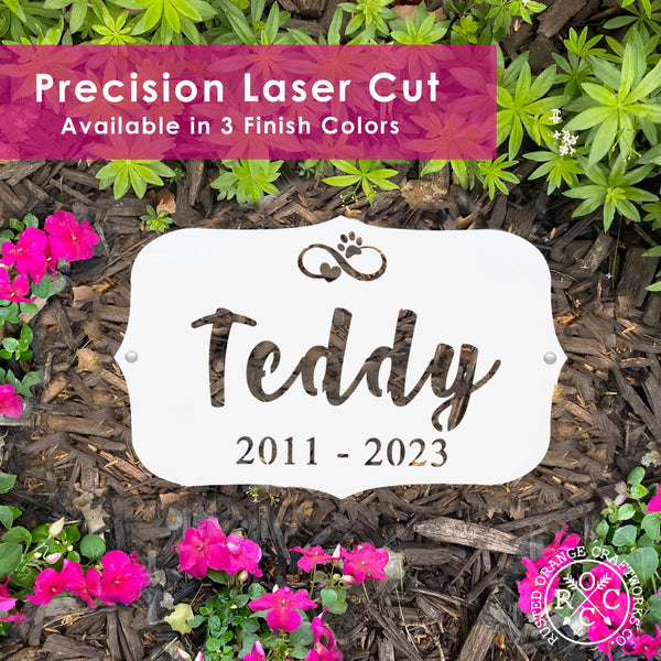 pet memorial plaque laying flat in garden with banner that says precision laser cut available in 3 finish colors