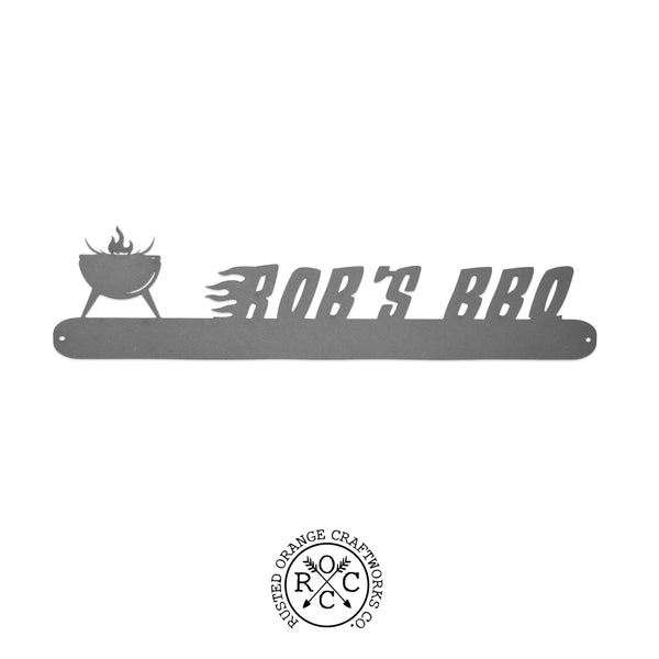 grill style grill utensil holder that says "bob's bbq"