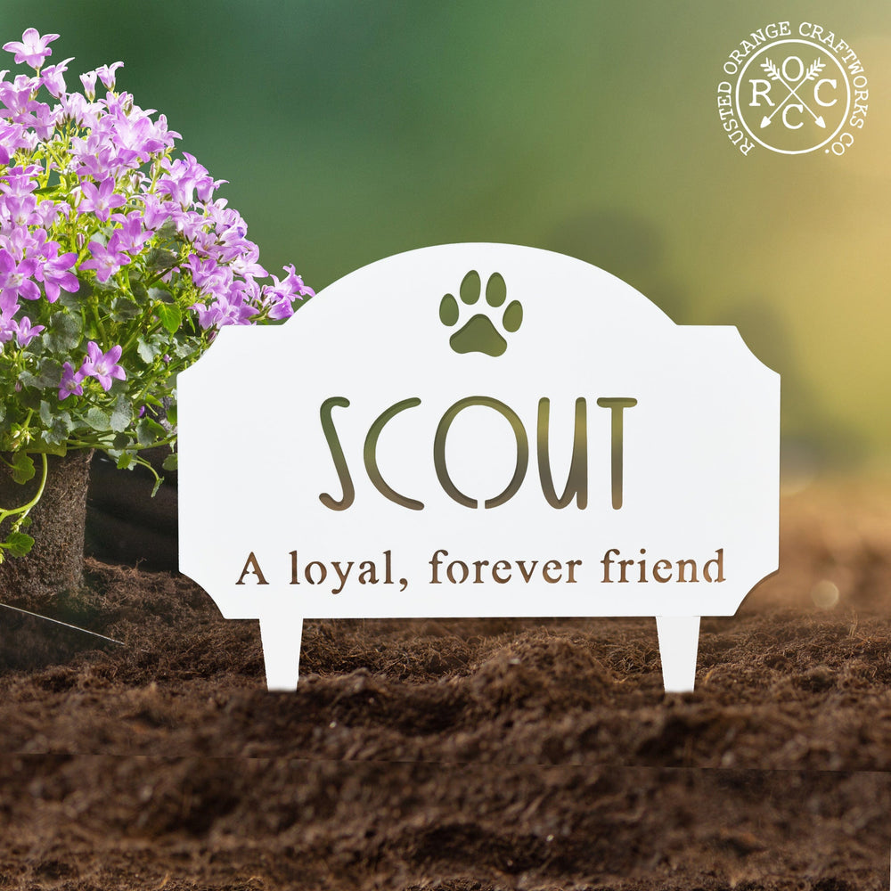 Pet memorial plaque staked in the garden