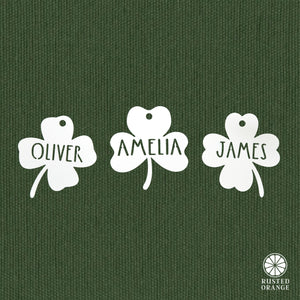Rusted Orange Craftworks Co. Seasonal & Holiday Decorations Personalized Shamrock Name Tags – Set of 3 Custom Metal Clover Cutouts