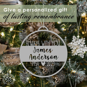memorial ornaments hanging on christmas tree with text that reads give a personailzed gift of lasting remembrance