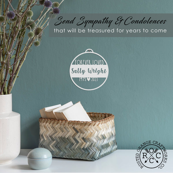 memorial ornament on wall with a banner that reads send sympathy and condolences that will be treasured for years to come