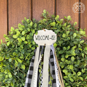 wreath badge on front door wreath welcome-ish style