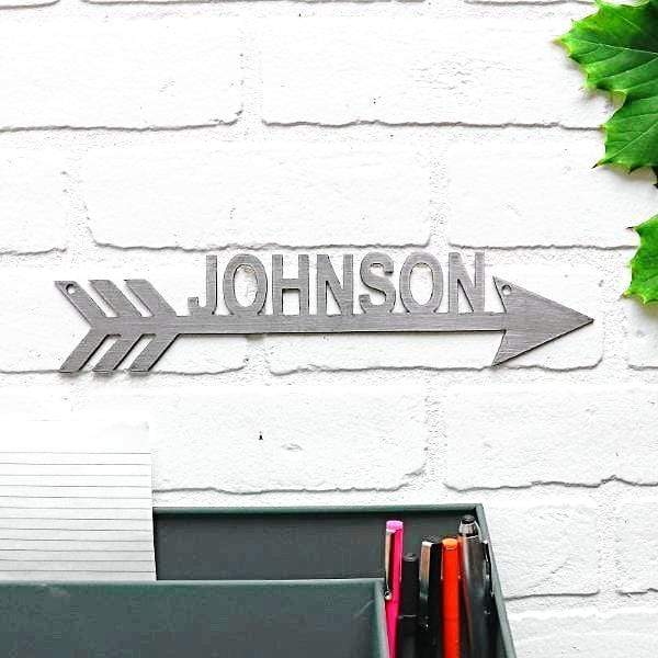 Arrow sign on wall