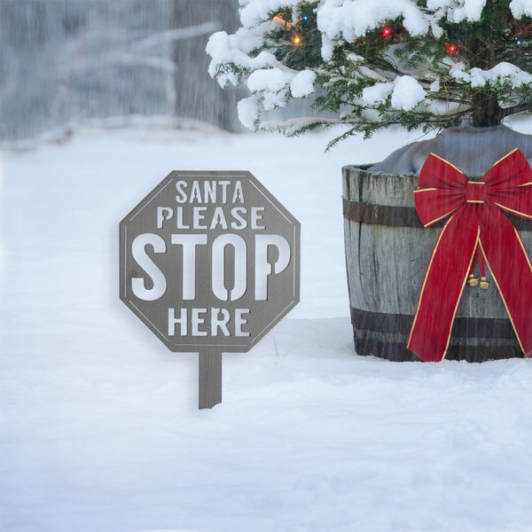 santa stop here sign in snow