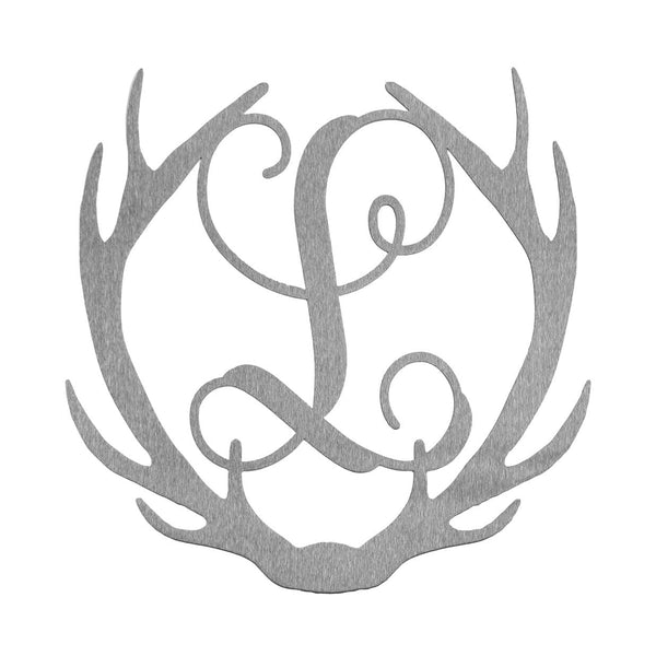 Metal deer antlers with monogram L in the middle, shown against white background.