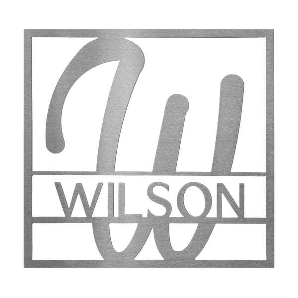 Metal square sign with name and monogram in center, against white background.
