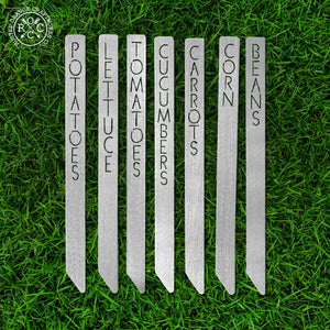 Metal garden markers lying in the grass