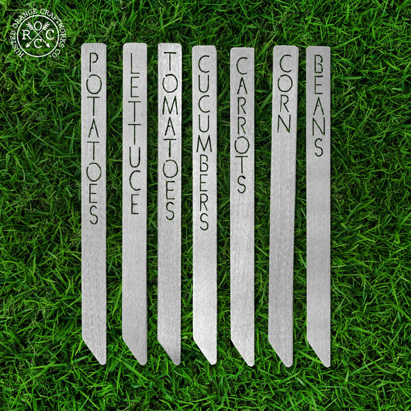 Metal garden markers lying in the grass