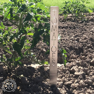 Metal garden marker staked in the dirt
