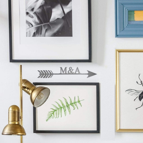 arrow sign on wall with other pictures