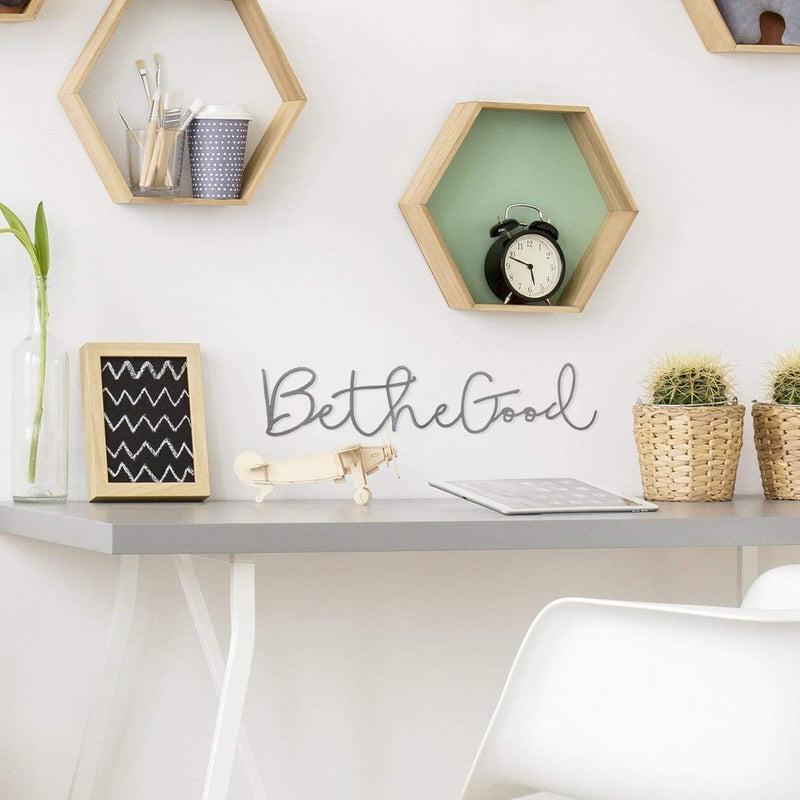 be the good sign on wall above desk