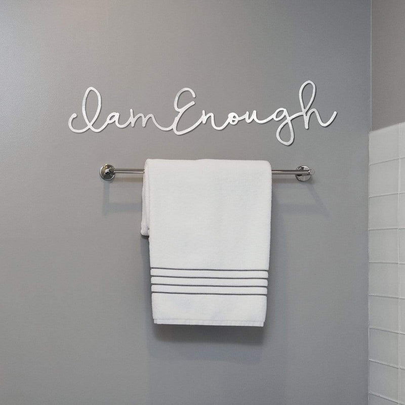 I am enough sign on wall in bathroom