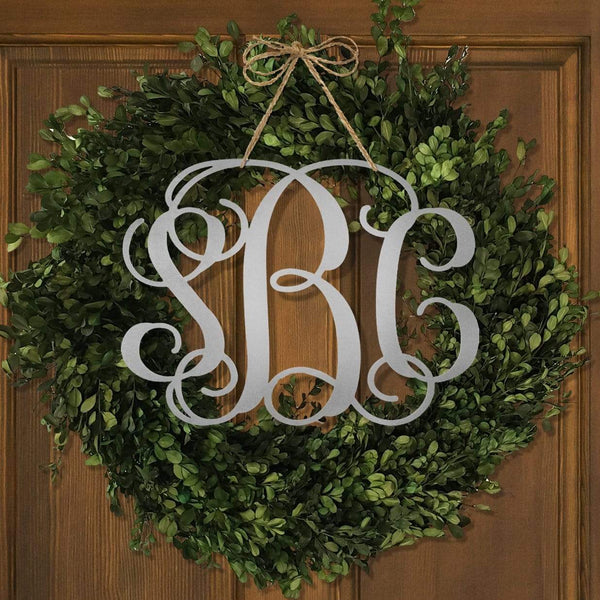 fancy letter monogram on front door wreath