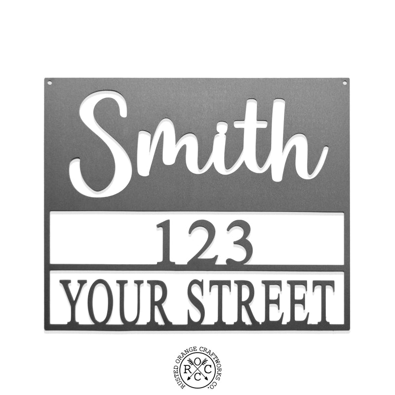 Square metal sign with last name and address shown against white background.