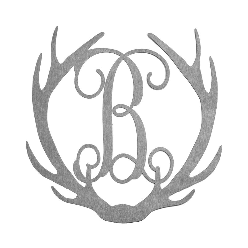 Metal deer antlers with monogram B in the middle, shown against white background.
