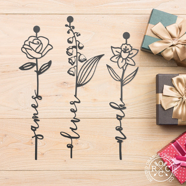 3 metal flowers on the table