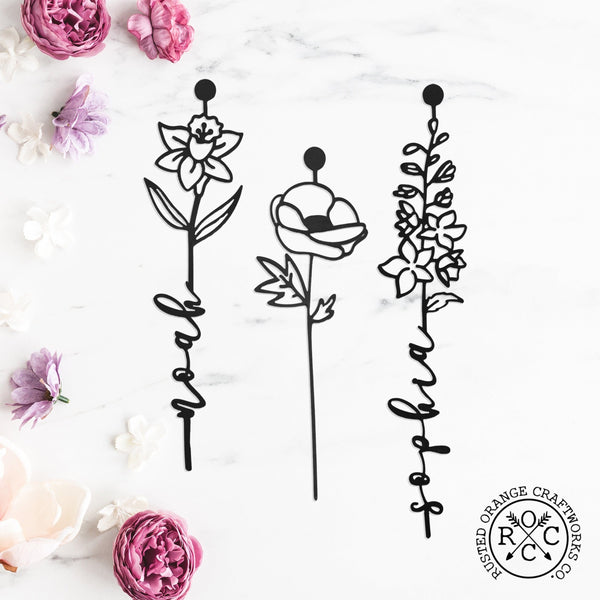 3 metal flowers on the table