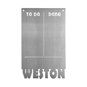 Magnetic board with to do and done etched on top and custom name at bottom, shown against white background.