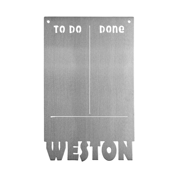 Magnetic board with to do and done etched on top and custom name at bottom, shown against white background.