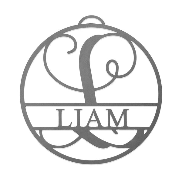 Circle metal ornament with name and monogram in center, shown against white background.