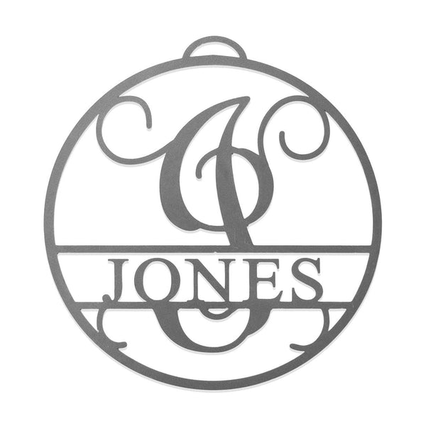 Circle metal ornament with name and monogram in center, shown against white background.