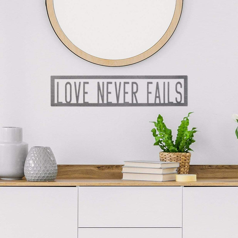 love never fails phrase sign on wall