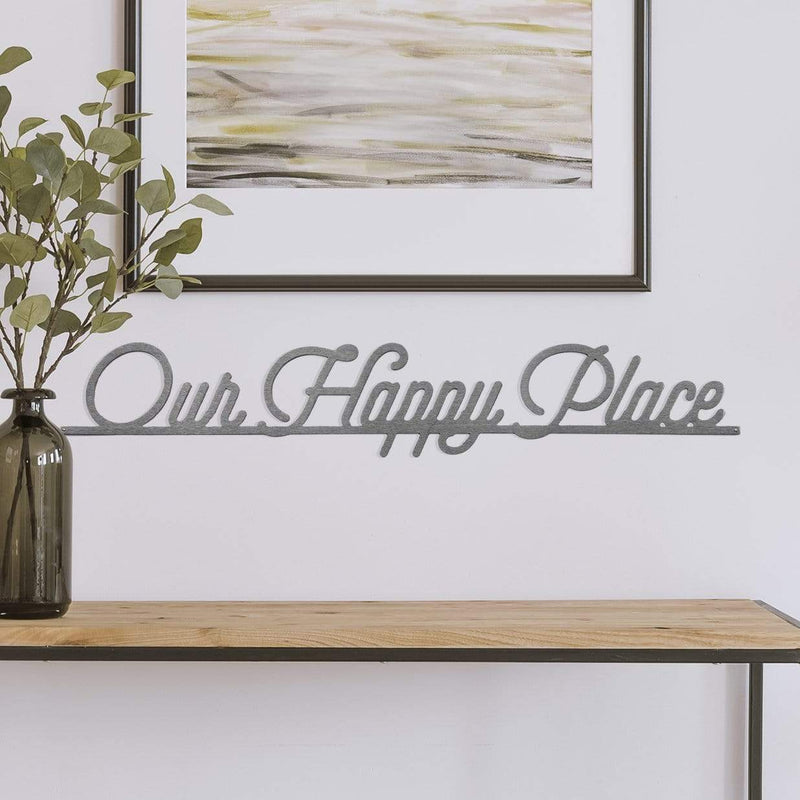 our happy place sign on wall above counter