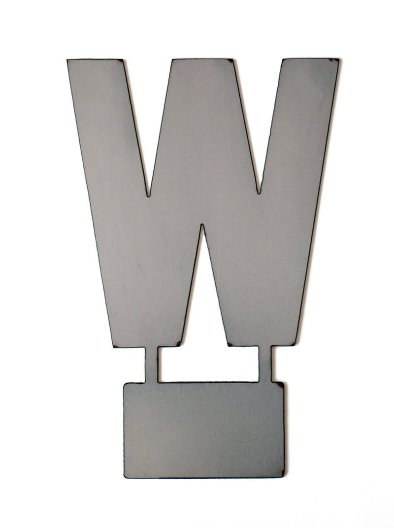 Metal letter W with tab on bottom for standing, shown against white background.