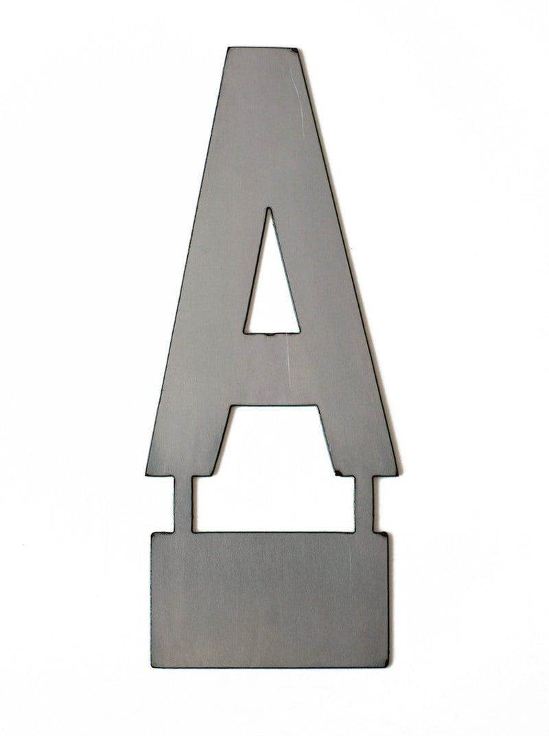 Metal letter A with tab on bottom for standing, shown against white background.