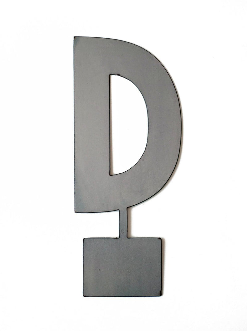 Metal letter D with tab on bottom for standing, shown against white background.