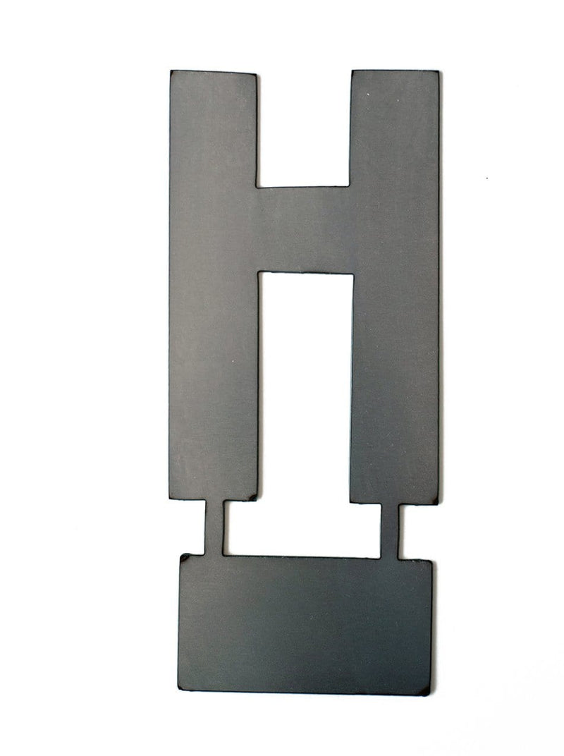 Metal letter H with tab on bottom for standing, shown against white background.