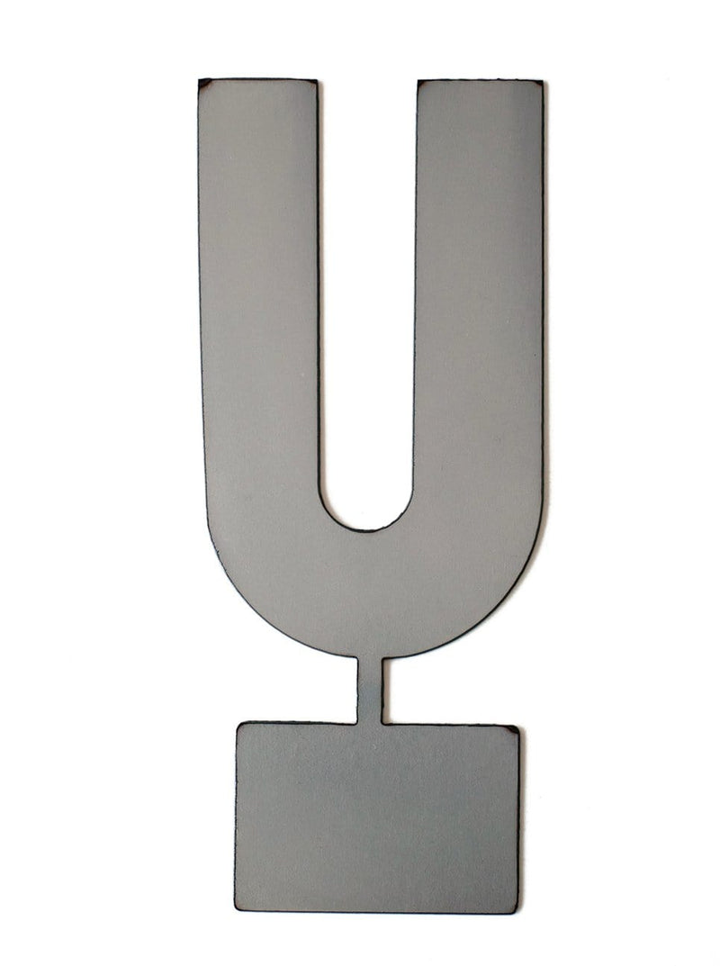 Metal letter U with tab on bottom for standing, shown against white background.