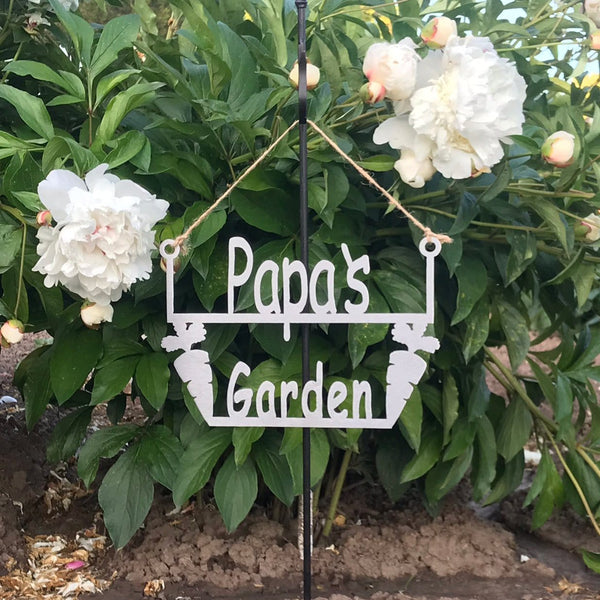 Papas garden sign in front of flower bush