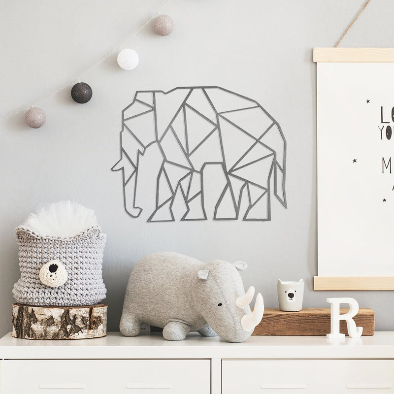 Geometric elephant on wall above dresser