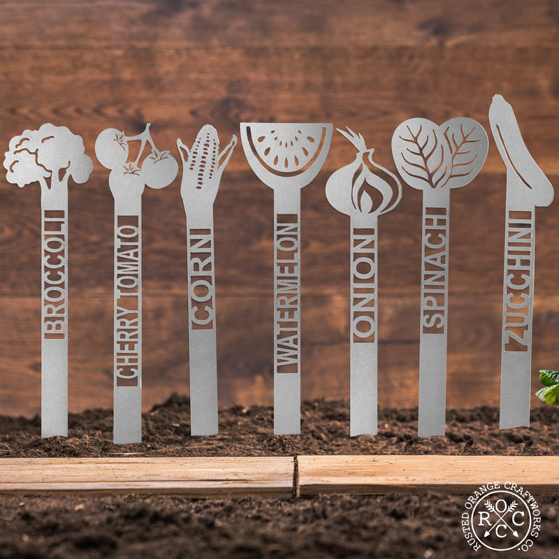 variety of plant stakes in dirt