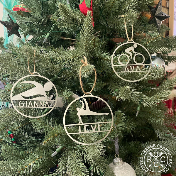 sports ornaments hanging on Christmas tree