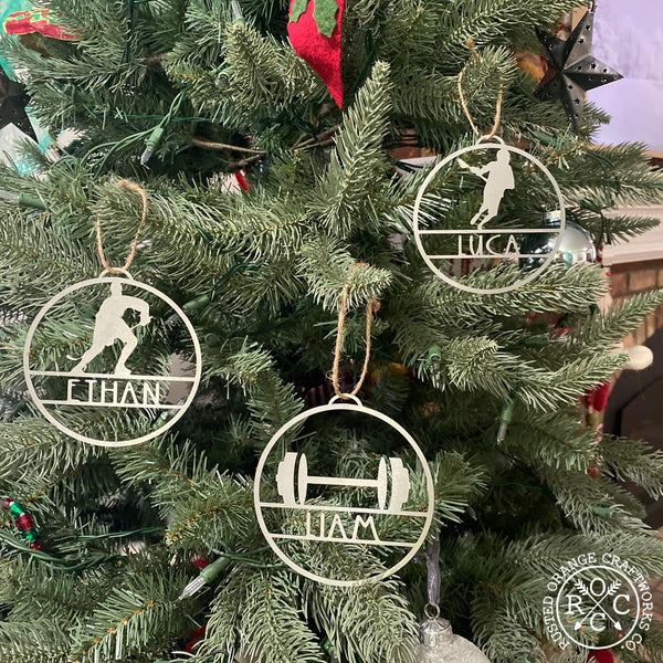sports ornaments hanging on Christmas tree