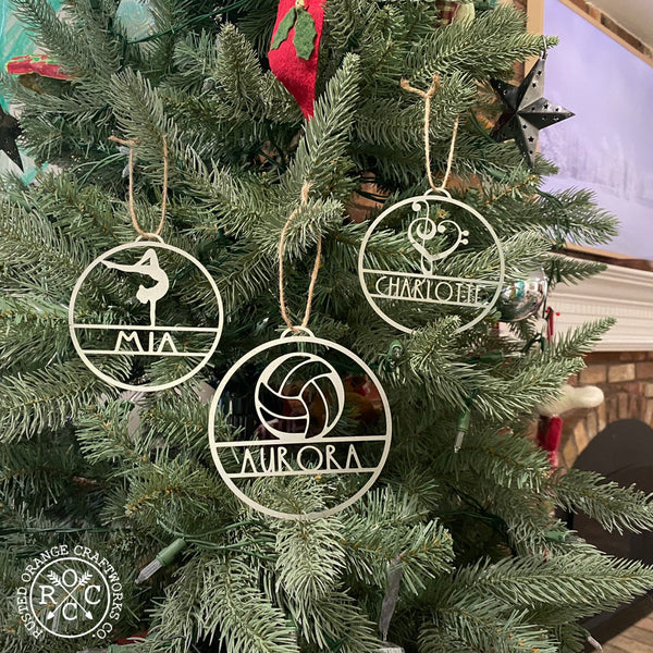 sports ornaments hanging on Christmas tree