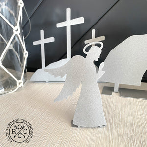 Angel and crosses on mantle
