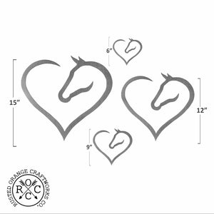 4 metal heart shaped horse silhouettes showing size comparison.