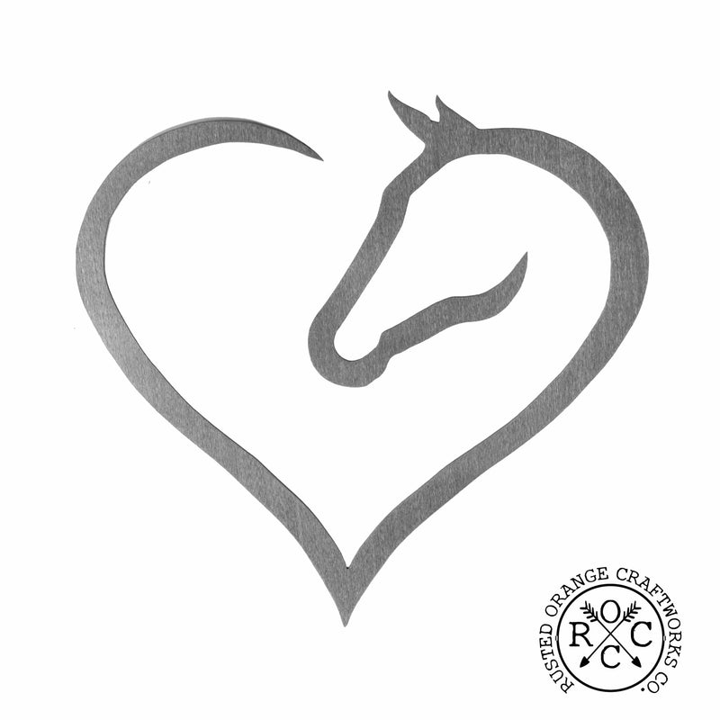 Metal heart shaped horse silhouette against white background.