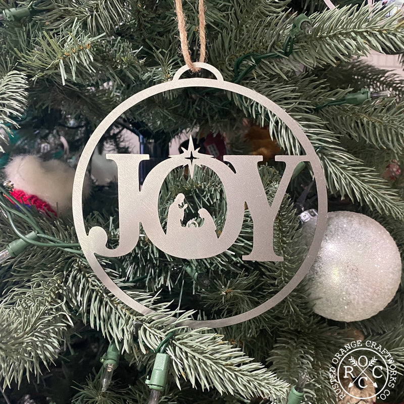 joy ornament on christmas tree
